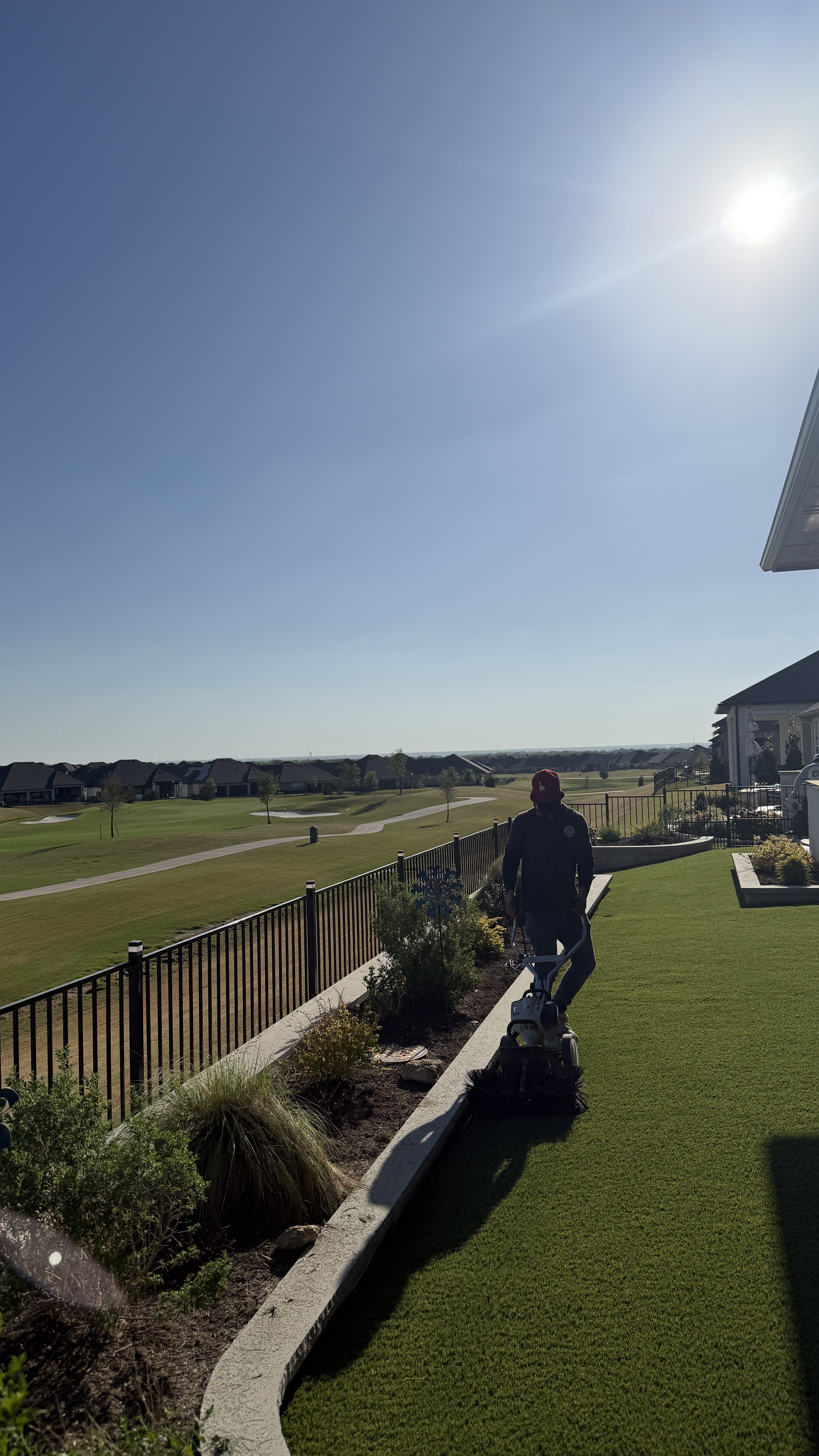 Backyard artificial turf installation in a golf course community DFW