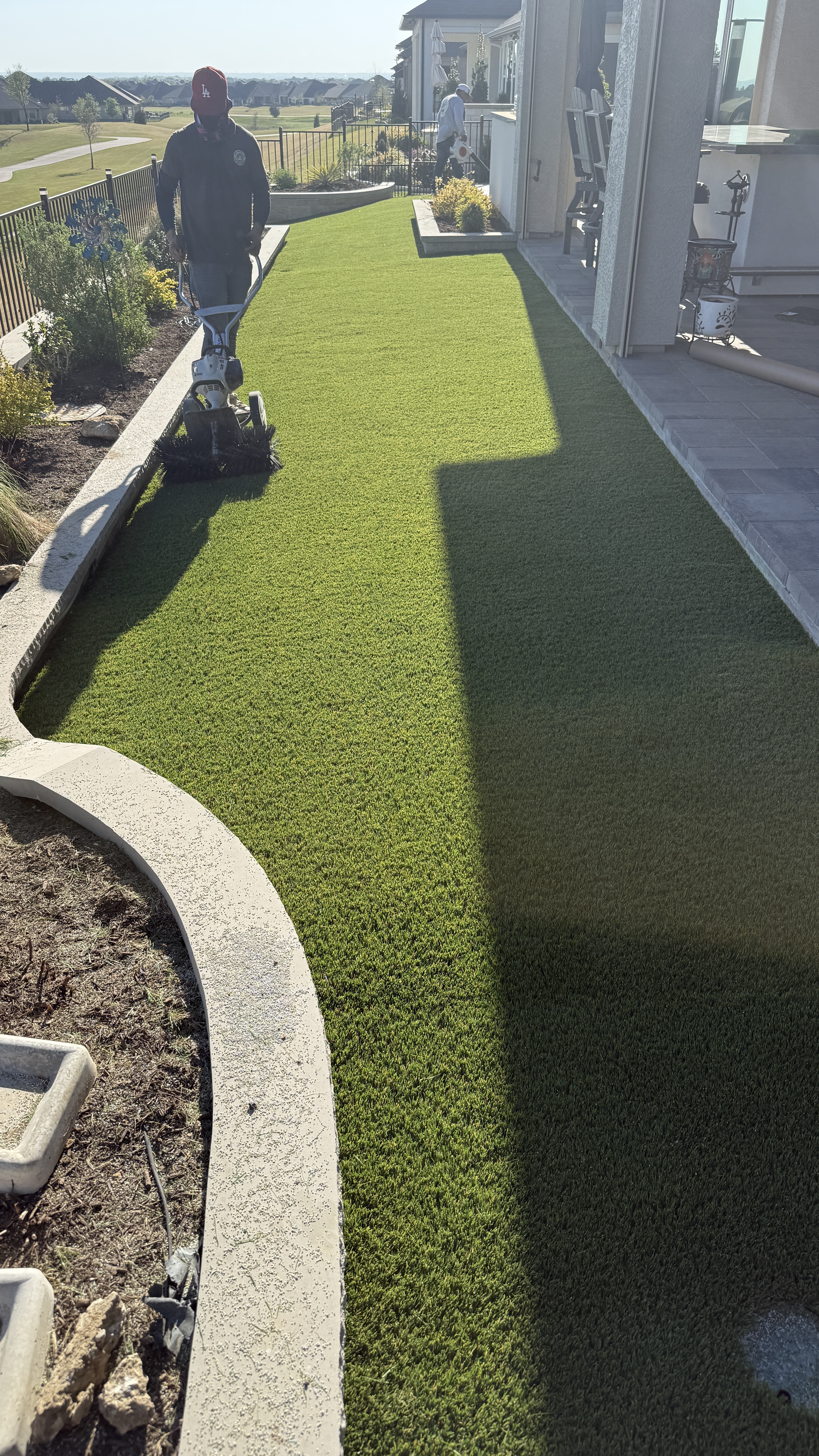 Green Forever installer power brushing artificial turf backyard DFW