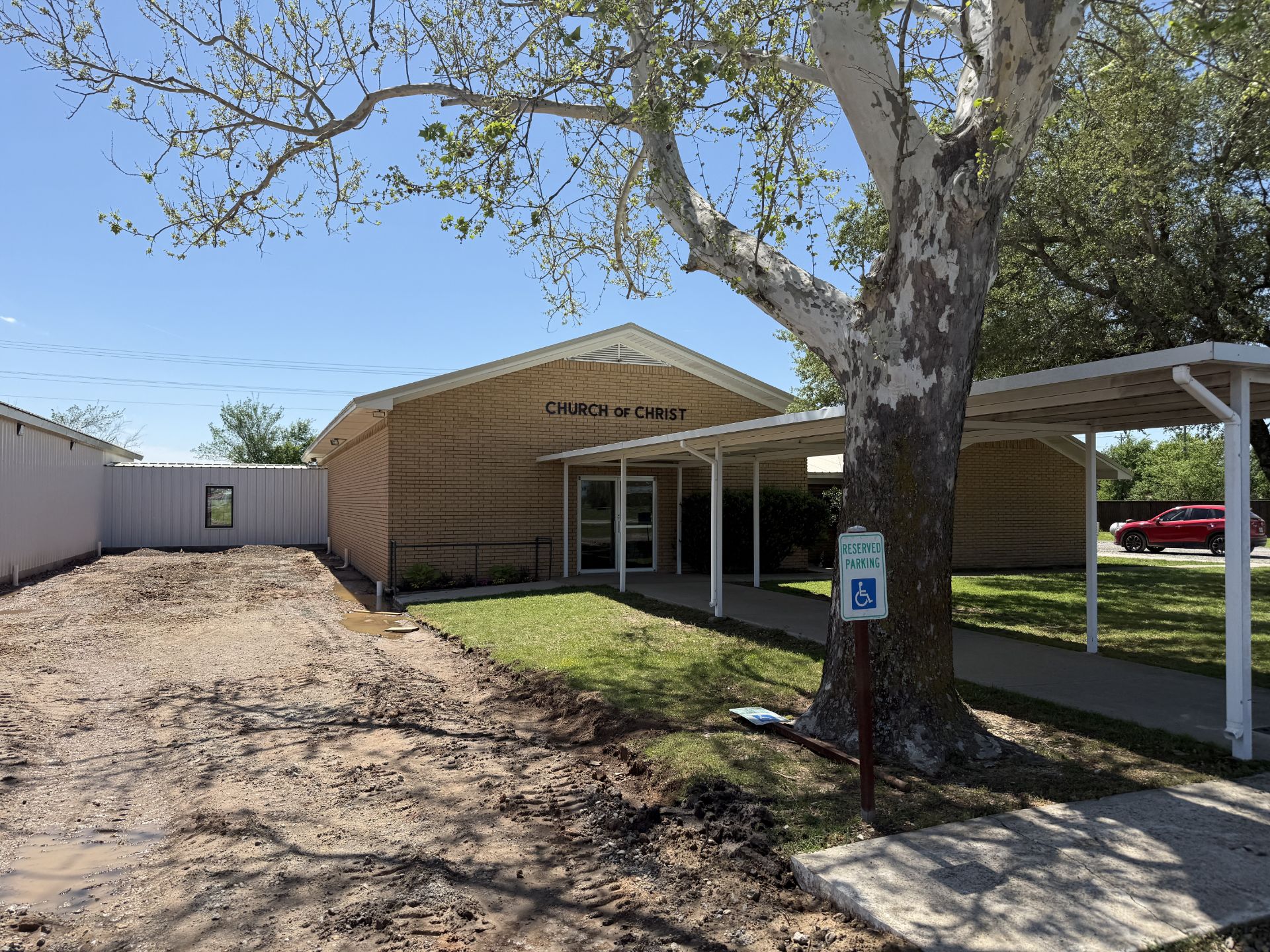 New construction home in Prosper TX with bare landscape ready for artificial turf installation