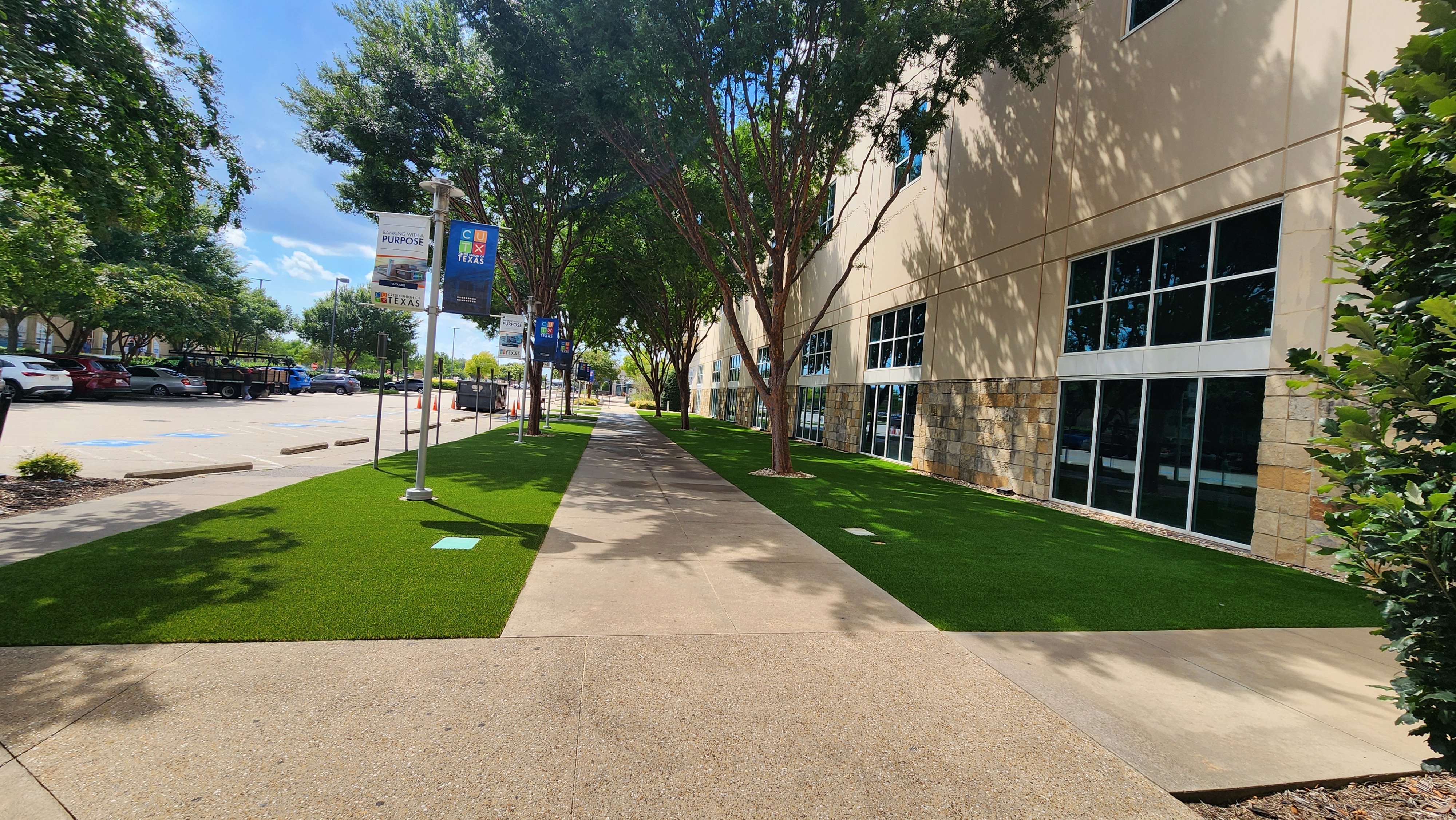 Commercial artificial turf installation at office building walkway - Green Forever Turf Texas