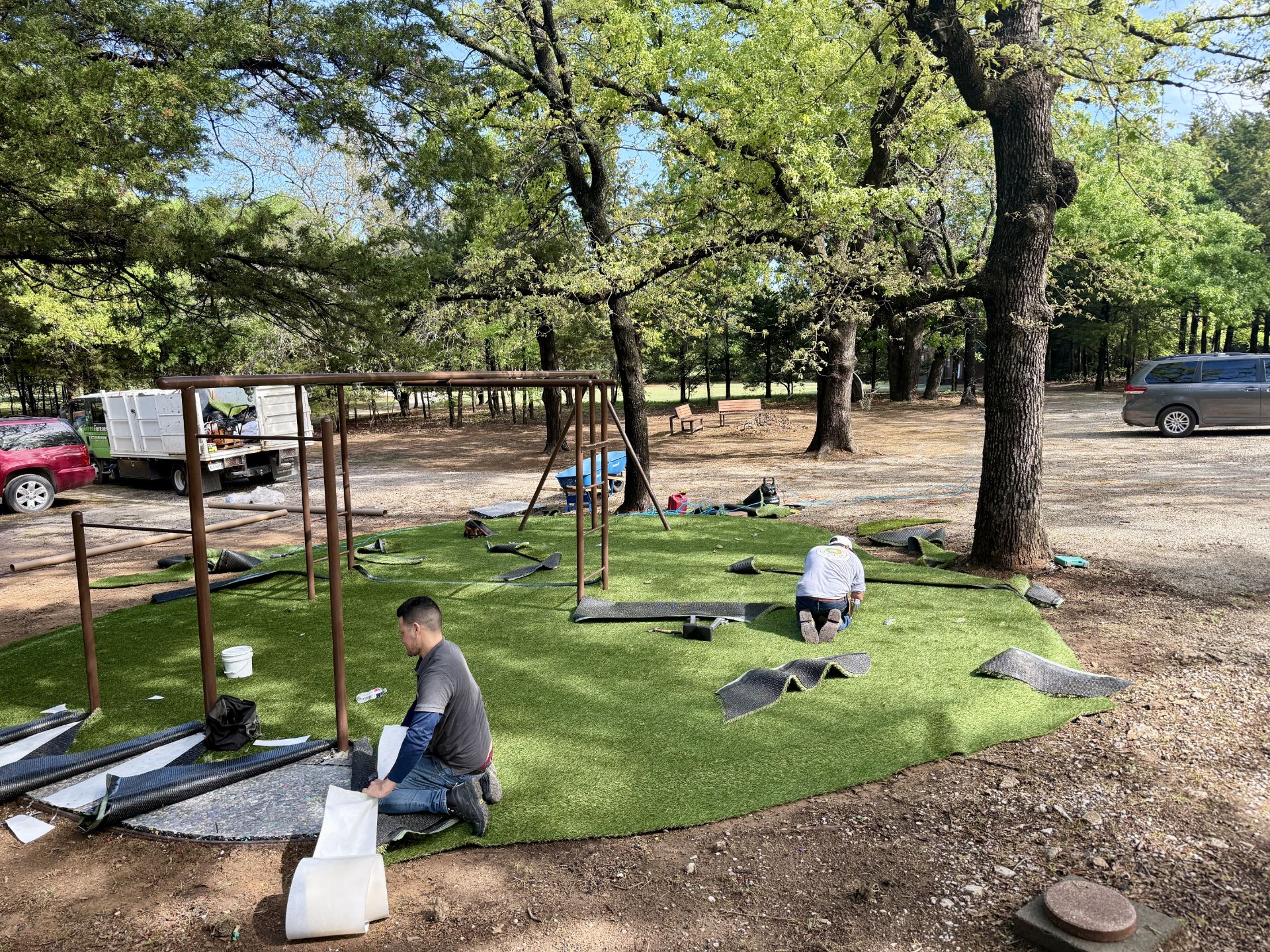 Green Forever Turf crew installing artificial turf at a job site in DFW