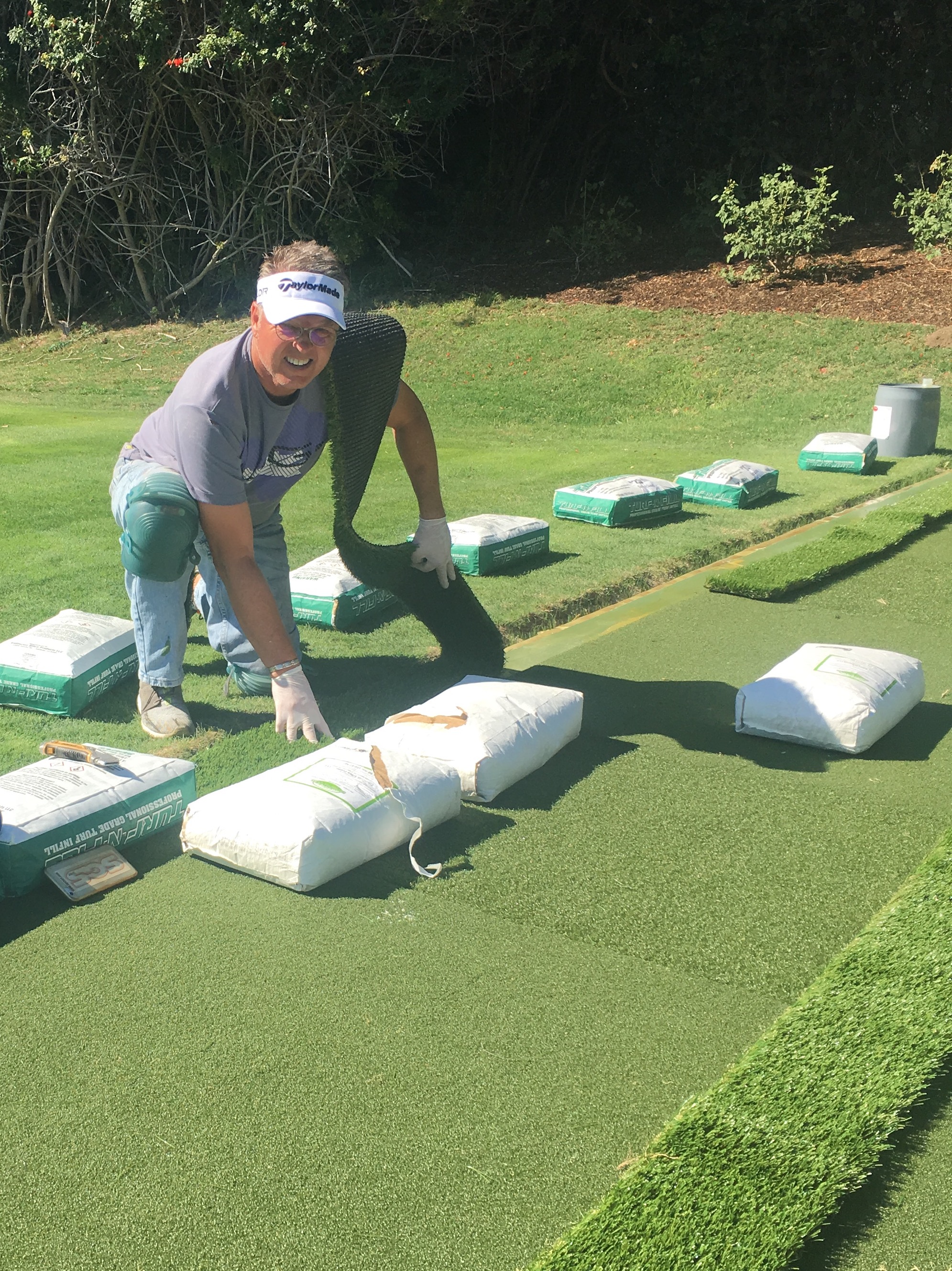 Mark A. Du Pont, owner of Green Forever Turf Texas, on a backyard putting green install
