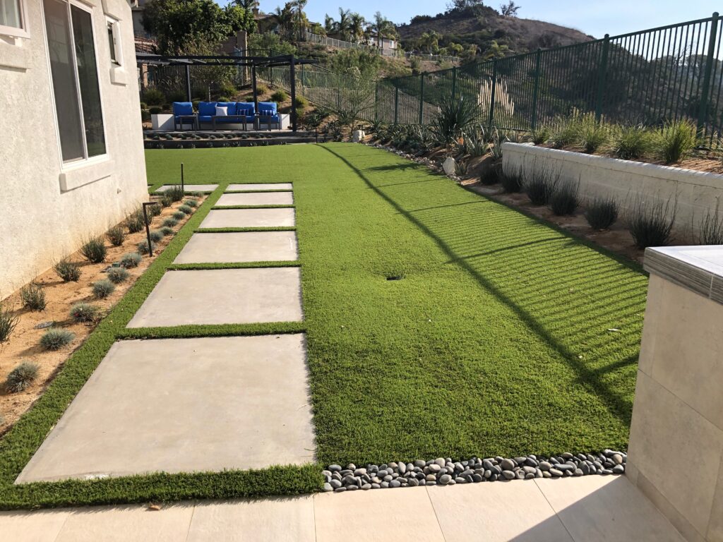Concrete slab with turf and stepping stones