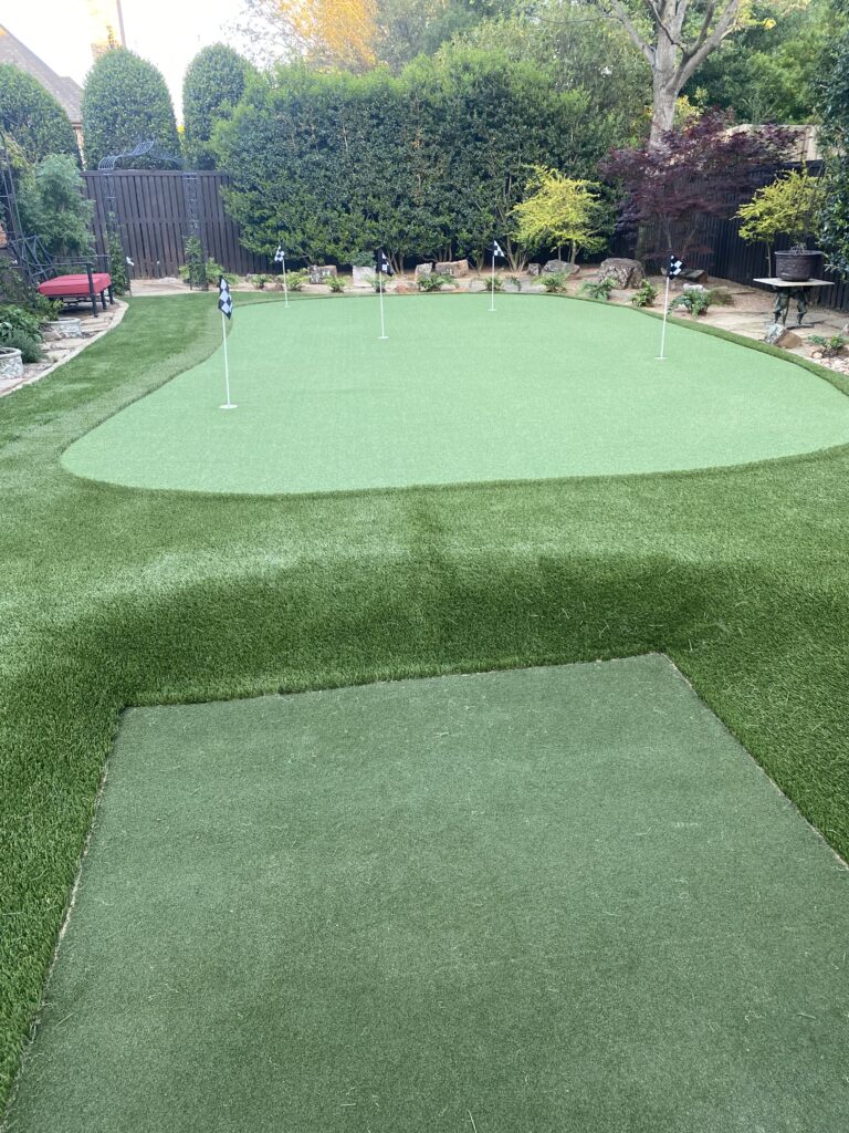 Backyard putting green with multiple holes and fringe