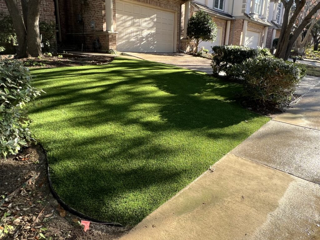 Residential artificial turf along driveway