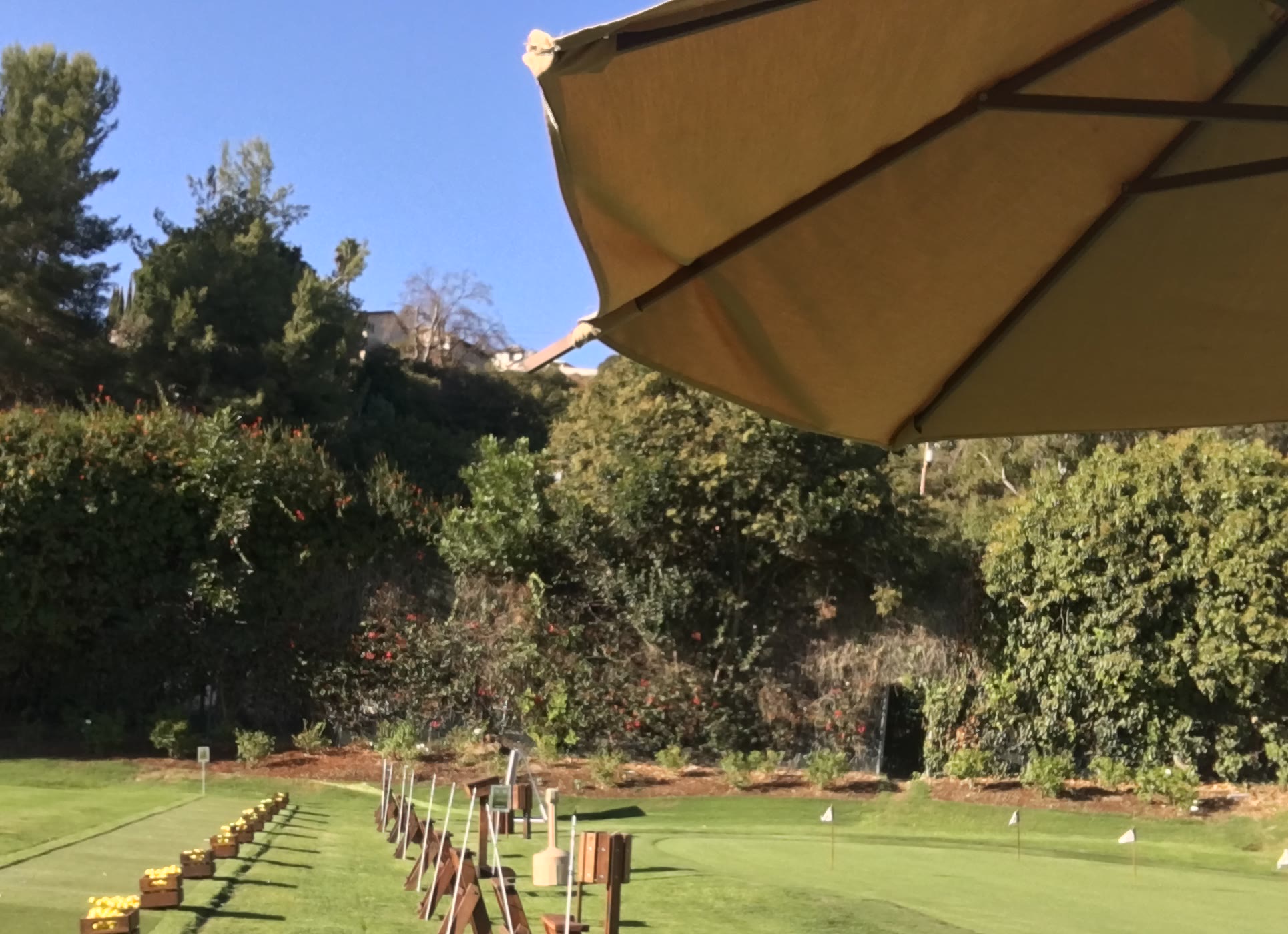 Golf driving range tee stations