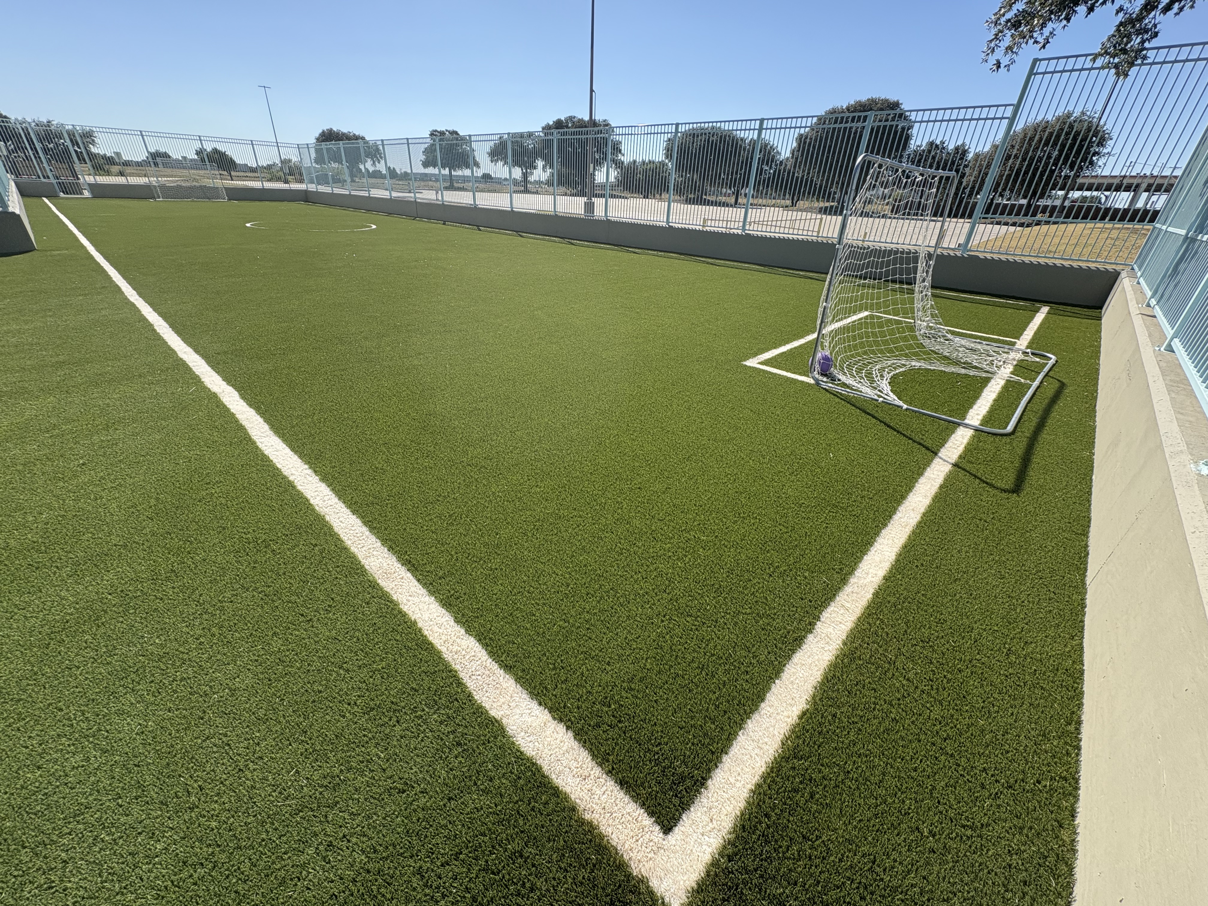 Sports field soccer goal corner installation - Green Forever Turf Texas