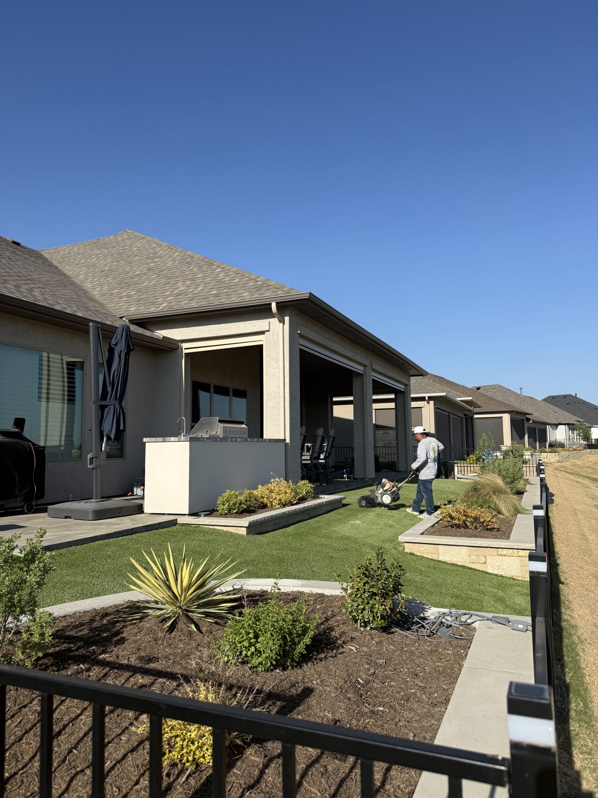 After: turf side yard with planters and landscaping